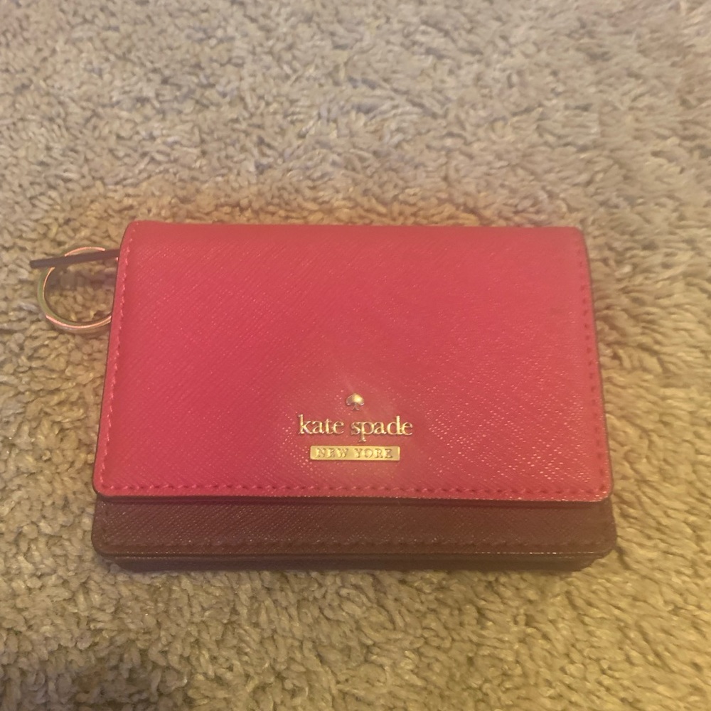 Kate Spade wallet, purple/pink, 4.5 in by 3.25 in, leather material.